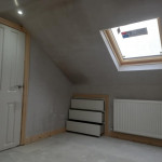 fresh plaster on loft conversion showing dormer window and in wall storage