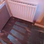 wooden floor with fresh plaster onwalls